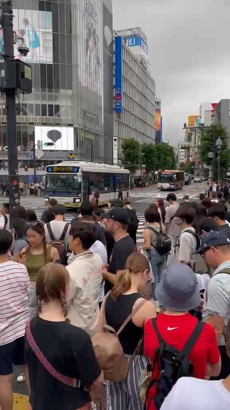 Crowds crossing the famous Shibuya scramble crossing in Tokyo, Japan